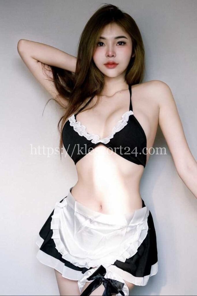Chalida, a Thailand Escort KL, poses in a black and white outfit.