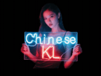 Woman holding neon sign: "Chinese KL